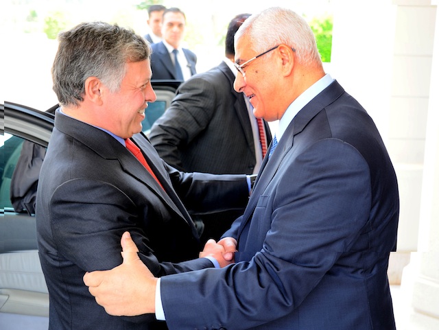 ROYAL VISIT. A handout photo released by the Egyptian Presidency shows Egyptian interim President Adli Mansour (R) welcoming Jordanian King King Abdullah II (L) in Cairo, Egypt, 20 July 2013. Photo by EPA/Egyptian Presidency/Handout