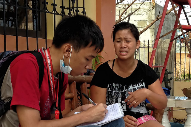 NOTHING. Elainne (R) recounts her story, saying they're left with nothing after Yolanda struck. Photo by Jonathan Jurilla