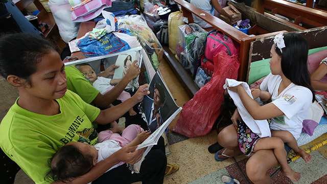 CROWDED EVACUATION CENTER. Residents seek refuge in a temporary evacuation center in Tacloban City, Leyte. File photo by Dennis Sabangan/EPA 