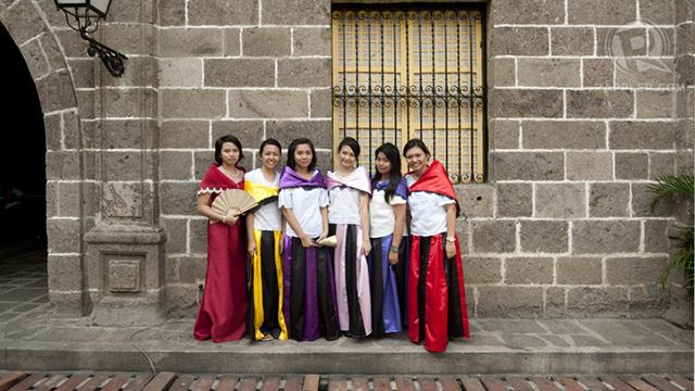 Ladies in 'Maria Clara' costumes in Intramuros (the attire is named after a female character in Jose Rizal's 'Noli Me Tangere')
