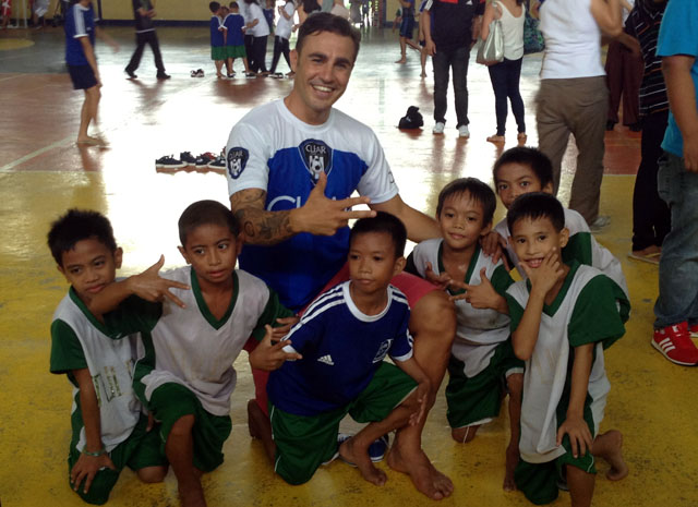 ALL SMILES. Cannavaro played barefoot with these kids. Photo by Rappler/Alexx Esponga.