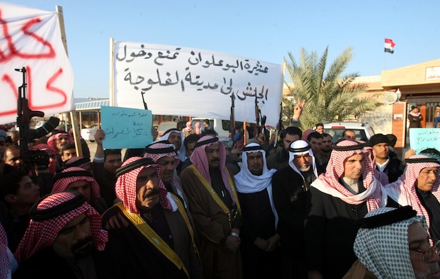 INSURGENCY. Members of Albu Alwan tribe protest against the military operation in Fallujah city, western Iraq, 07 January 2014. The banner (C) reads in Arabic 'Albu Alwan tribe prevents the entry of the army into Fallujah'. Mohammed Jalil/EPA