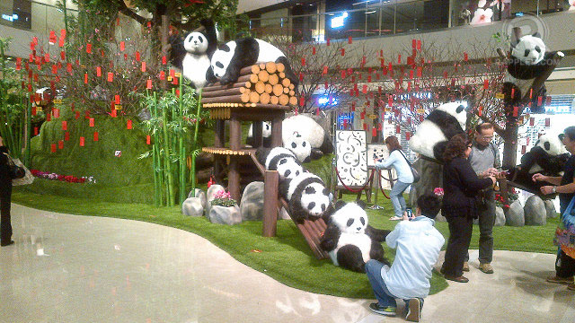 Panda display in ifc Mall, Central, Hong Kong Island. Take note of 'lai see' packets hanging from the tree.
