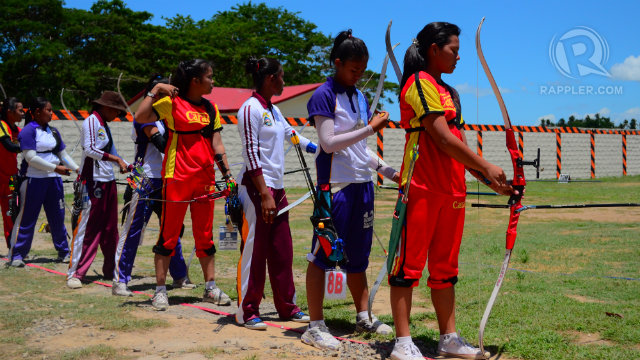 Female archers take aim at practice during Palarong Pambansa 2014. Photo by Jerome Monta/Rappler