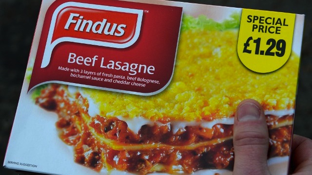 BEEF OR HORSEMEAT? A man poses holding a Findus 320g beef lasagne frozen readymeal near Sunderland on February 8, 2013. Tests confirming beef lasagne sold under the Findus brand contained up to 100 percent horsemeat sparked a wider food scare in Britain on February 8 with authorities ordering urgent tests on all beef products on sale. AFP PHOTO / ANDREW YATES