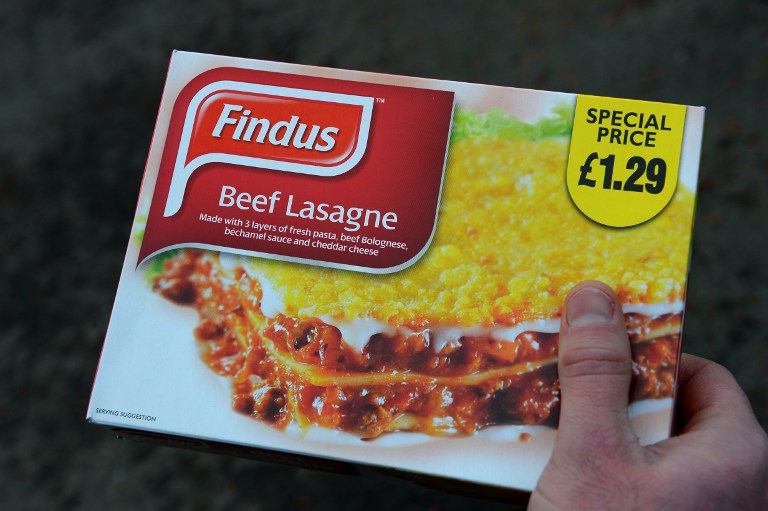 BEEF OR HORSEMEAT? A man poses holding a Findus 320g beef lasagne frozen readymeal near Sunderland on February 8, 2013. Tests confirming beef lasagne sold under the Findus brand contained up to 100 percent horsemeat sparked a wider food scare in Britain on February 8 with authorities ordering urgent tests on all beef products on sale. AFP PHOTO / ANDREW YATES