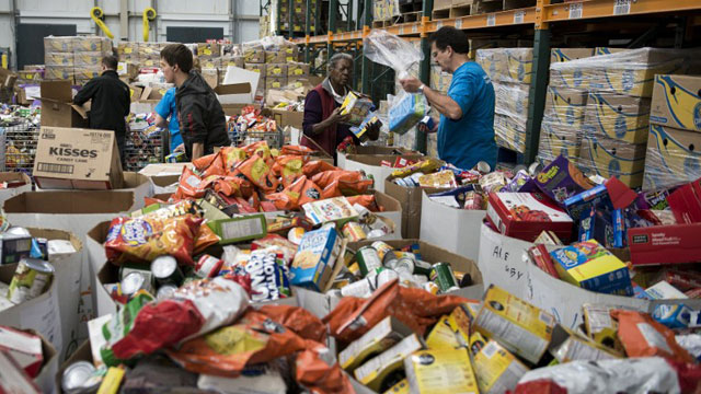 ALL FOR ONE. Food banks prove to be a game changer in addressing hunger within communities. Photo by Brendan Smialowski/AFP