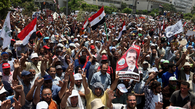 FRESH PROTESTS. Supporters of ousted Egyptian President Mohamed Morsi gather as they protest near the headquarters of the Republican Guard, in Cairo, Egypt, 06 July 2013. Photo by EPA/KHALED ELFIQI