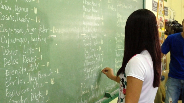 MANUAL TALLY. Election inspectors audit the PCOS count. Photo by Paterno Esmaquel II
