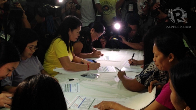 SAMPLE BALLOTS. Ten voters fill out ballots that they will use to test the PCOS. Photo by Paterno Esmaquel II
