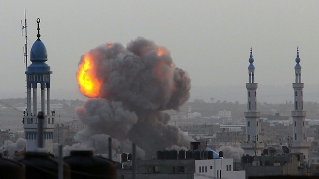 UNDER SIEGE. A fire ball rises as the Israeli air force carries out a raid over Gaza City on November 17, 2012, for the fourth consecutive day. AFP PHOTO/MAJDI FATHI
