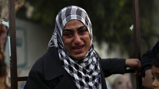 GAZA ATTACKED. A Palestinian woman cries after she evacuated her home to take shelter at a United Nations (UN) school in Gaza City on November 20, 2012. AFP PHOTO/ MOHAMMED ABED