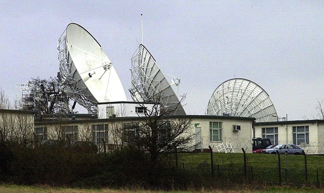SPY HQ? This picture taken 24 February 2000 shows the radar dishes at the Britain's Government Communications HQ's Benhall site, Cheltenham, some 150 kilometers (95 miles) west of London. The facility is thought to be a main link in the Echelon telecoms spy network and is a keystone of US-British cooperation on electronic intelligence. File photo by Martyn Hayhow/EPA