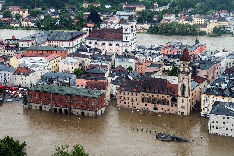 OVERFLOWING RIVERS. The rivers Inn (back) and Danube flood the old city of Passau, southern Germany, on June 1, 2013. Photo by Armin Weigel/AFP