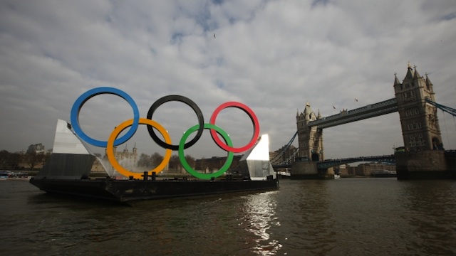 OLYMPIC FEVER. Measuring 11 meters high by 25 meters wide, a set of giant Olympic Rings travel on a barge past Tower Bridge in London, February 28, 2012. Photo courtesy of London 2012