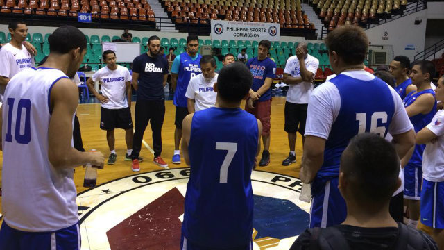 THIS YEAR THE WORLD. Gilas coach Chot Reyes speaks in the middle of Team Philippines at Monday's opening practice to prepare for the FIBA World Cup. Photo by Jane Bracher