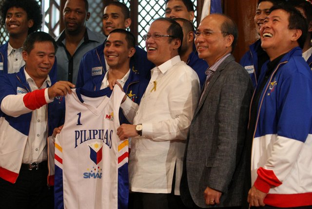 President Benigno S. Aquino III receives a Smart Gilas Pilipinas basketball jersey during the courtesy call of the members of the basketball team champion in the 34th William Jones Cup at the President's Hall, Malacanang Palace. Photo by: Robert Viñas/ Malacanang Photo Bureau