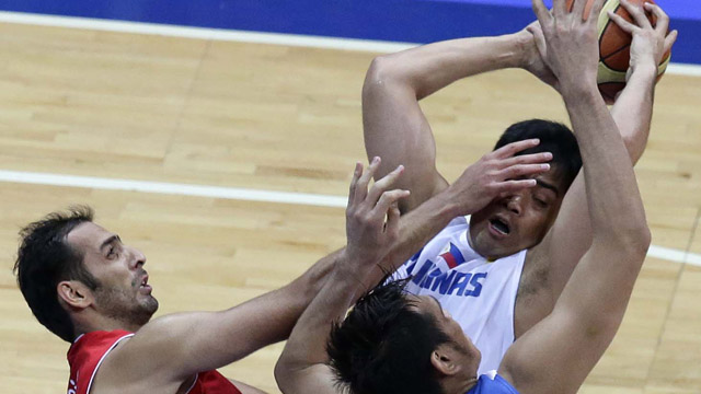 SMOTHERED. Gilas couldn't get its offense going against the big Iranians. Photo by EPA/Dennis Sabangan.