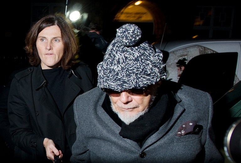 Former British rock star Gary Glitter, whose real name is Paul Gadd, returns home in central London on October 28, 2012, after he was arrested earlier in the day by British police as they probe the mountain of sexual abuse allegations against the late TV star Jimmy Savile. AFP PHOTO/LEON NEAL