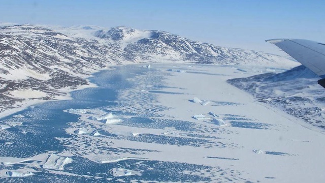 FROZEN. A frozen fjord along northeast coast of Greenland as seen from the P-3 aircraft on May 14, 2012. Credit: NASA/Jim Yungel