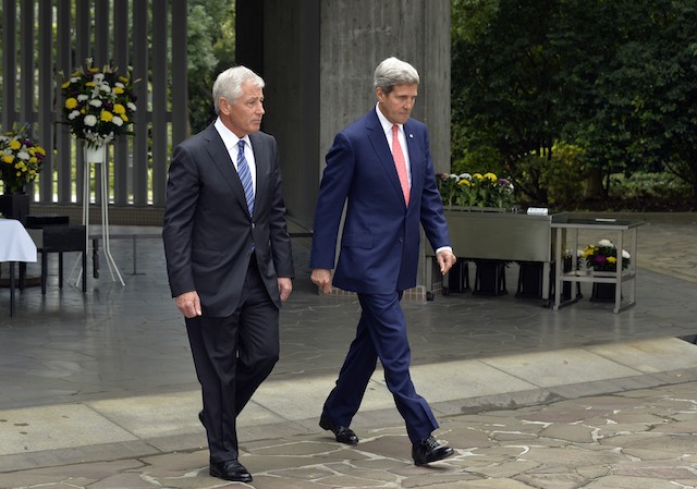PAYING RESPECTS. US Secretary of Defense Chuck Hagel (L) and Secretary of State John Kerry (R) walk after paying their respects to WWII war dead at Chidorigafuchi National Cemetery in Tokyo, Japan, 03 October 2013. EPA/Franck Robichon/Pool