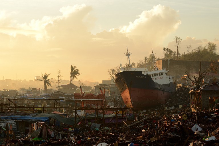 STORM SURGE AFTERMATH. A ship washed ashore by storm surges during the height of Super Typhoon Haiyan (Yolanda) sits atop crushed houses in Tacloban, Leyte in November 25, 2013. AFP/Noel Celis