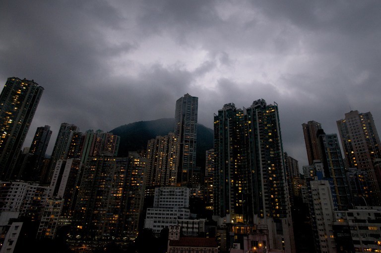 BREWING STORM. Dark clouds are pictured over the skyline of Hong Kong island as Typhoon Usagi approaches the territory on September 22, 2013. AFP/Alex Ogle