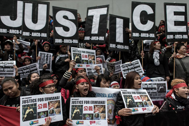 JUSTICE FOR ERWIANA. Demonstrators shout slogans during a march in January 2014 in support of an Indonesian maid who was allegedly tortured by her employer in Hong Kong. Photo by Philippe Lopez/AFP