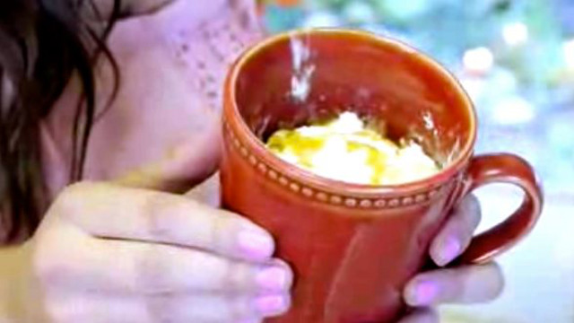 WINNING COMBINATION. Orange mug plus frothy hot chocolate is heaven. Screen grab from YouTube (BethanysLife)