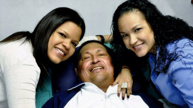 CHAVEZ DEAD. Venezuela's President Hugo Chavez surrounded by his daughters at a hospital in Havana. Photo from AFP