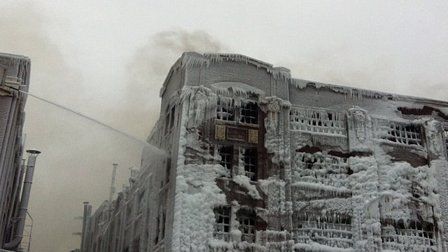 ICE WATER. Ice forms as firefighters battle blaze in Chicago. Photo by Ziad Jaber/ NBC News
