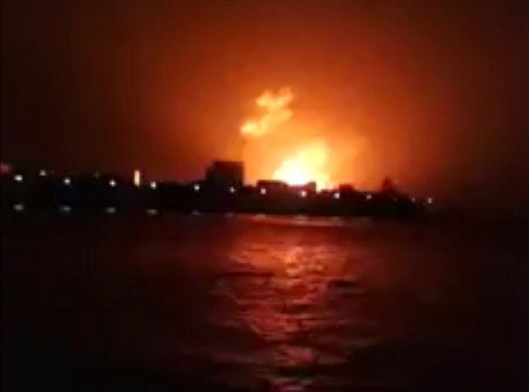 FIRE AT THE DOCK. This frame grab taken from video footage provided by Indian broadcaster NWS early on August 14, 2013, shows a fire at the Indian Naval Dockyard in Mumbai. AFP/NWS