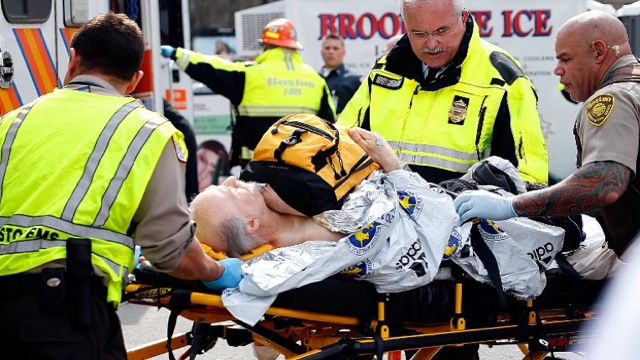 INJURED. A man is loaded into an ambulance after he was injured by one of two bombs exploded during the 117th Boston Marathon near Copley Square on April 15, 2013 in Boston, Massachusetts. Jim Rogash/Getty Images/AFP