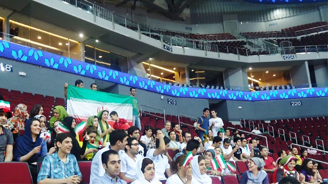 SUPPORTERS. Iran supporters, many of them students here, rally behind their team. All photos by Levi Verora