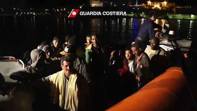 SURVIVORS. Some of the immigrants after their rescue near Lampedusa early on October 3, 2013, in this photo grab from video released by Italy's Guardia Costiera. AFP/ Guardia Costiera