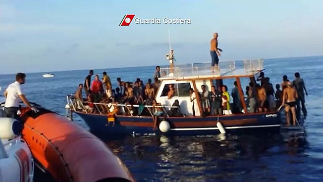 RESCUED. A screen grab from a video released by the Guardia Costiera on October 4, 2013 shows immigrants on a boat after their rescue near Lampedusa, Italy on October 3. Photo by AFP / Guardia Costiera