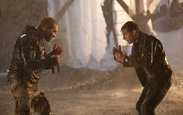 MANO A MANO, WOH-OH-HOH. Jai Courtney and Tom Cruise exchange wet blows
