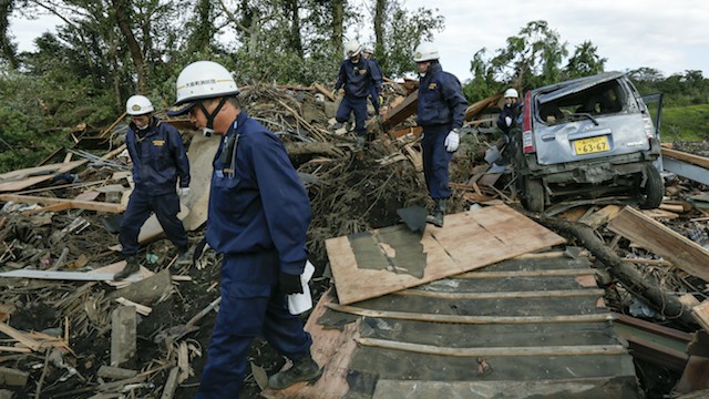AFTER WIPHA. Oshima local fire brigade members search for survivors at a mudslide site triggered by a strong typhoon on Oshima Island, a remote island south of Tokyo, Japan, 17 October 2013. EPA/Kimimasa Mayama