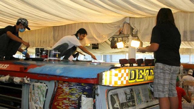 VOLUNTEERS PAINT THEIR FAVORITE Philippine destinations on a lucky jeepney