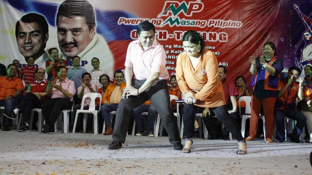 CAMPAIGN THEME. Sen Jinggoy Estrada performs the Gangnam Style with celebrity Marissa Sanchez at the PMP oath-taking. Photo from former President Estrada's Facebook page 