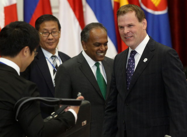 CANADA WITH ASEAN. John Baird (C), foreign minister of Canada, greets his counterparts from the Association of Southeast Nations ahead of the Post Ministerial Conference with Canada in Phnom Penh, Cambodia on July 11, 2012. Canada wants to increase both trade and ties between ASEAN member nations. Photo by Stephen Morrison/EPA