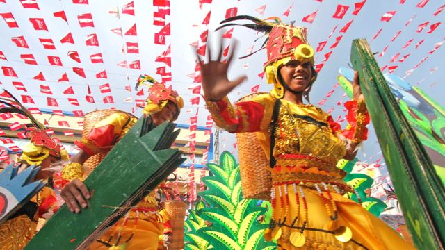 THE NARROW STREETS OF Davao City were flooded with colorful costumes and dancing