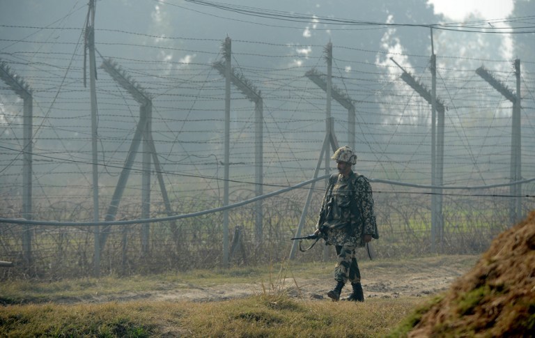 DISPUTED. In this file photo, an Indian Border Security Force (BSF) soldier patrols along the border fence at an outpost along the India-Pakistan border in Suchit-Garh, 36 kms southwest of Jammu on January 10, 2013. Photo by AFP/Tauseef Mustafa