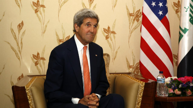 EXISTENTIAL THREAT. US Secretary of State John Kerry discusses the security situation in Iraq with Prime Minister Nuri al-Maliki on June 23, as insurgents continue to expand their control across the country. Photo by Thaier Al-Sudani/Pool/EPA