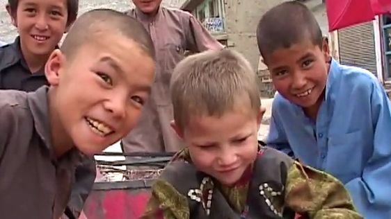 A SCENE RARELY SEEN: Kabul kids smiling. A screen grab from YouTube of the video 'Kids of Kabul' (noymanns)