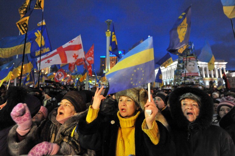 MORE PROTESTS. Protesters wave flags as they take part in an opposition rally on Independence Square in Kiev on December 7, 2013. AFP / Viktor Drachev