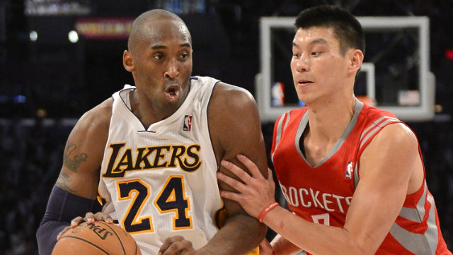 TEAMMATES. Kobe Bryant (L) drives against Jeremy Lin (R). The two will play together next season after a trade sent Lin to the Lakers. Photo by Michael Nelson/EPA