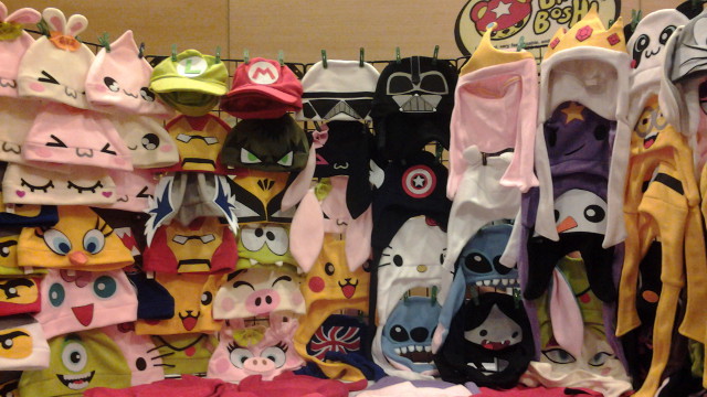 CUTE MERCHANDISE. These hats are only some of the goodies for sale at Summer Komikon