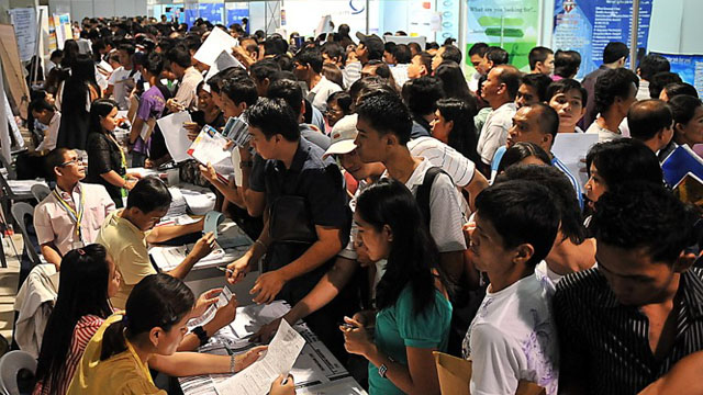 BETTER JOBS. A sea of applicants submit their resumes in the hopes of getting hired. Photo by AFP