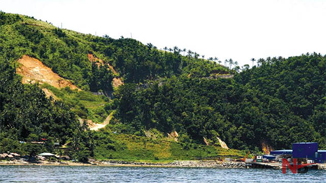 The approach to Rapu-Rapu island reveals natural beauty—from lush, verdant forests to mountainous steep slopes, clear waters, and natural rock formations. Only reddish rocks hint at a possible danger that lurks in the island: red iron sulfate precipitate. File Photo